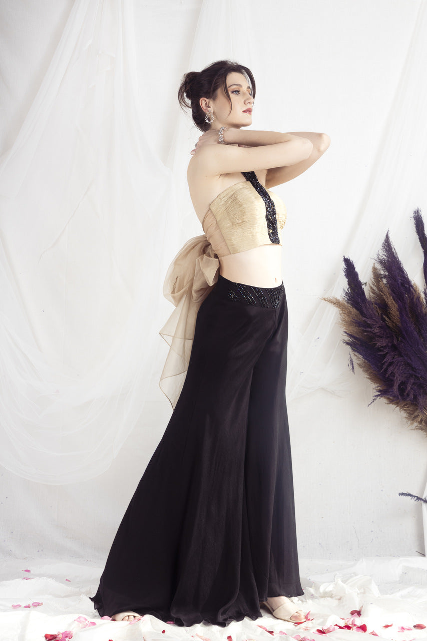 Beige halter neck blouse and black flared pants set