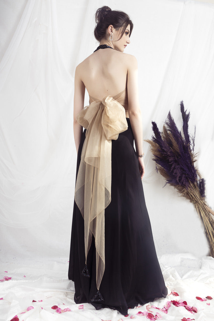 Beige halter neck blouse and black flared pants set